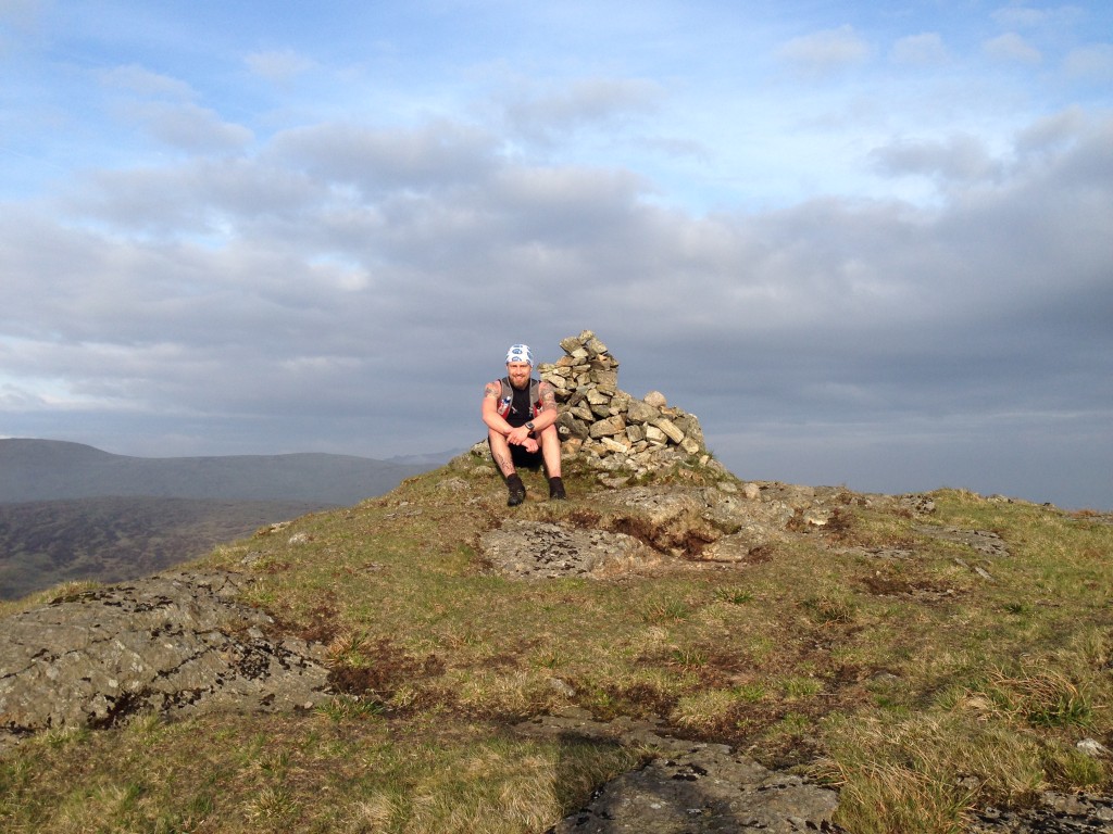 Aaron takes a break on the Slievemoughanmore summit cairn!